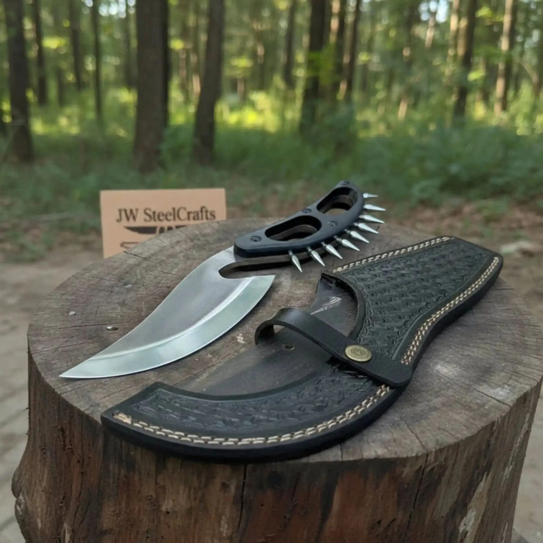 Carbon steel steel axe head with micarta handle on rustic wood surface