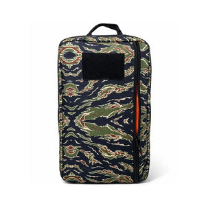 Camouflage backpack with black patch and orange zipper detail