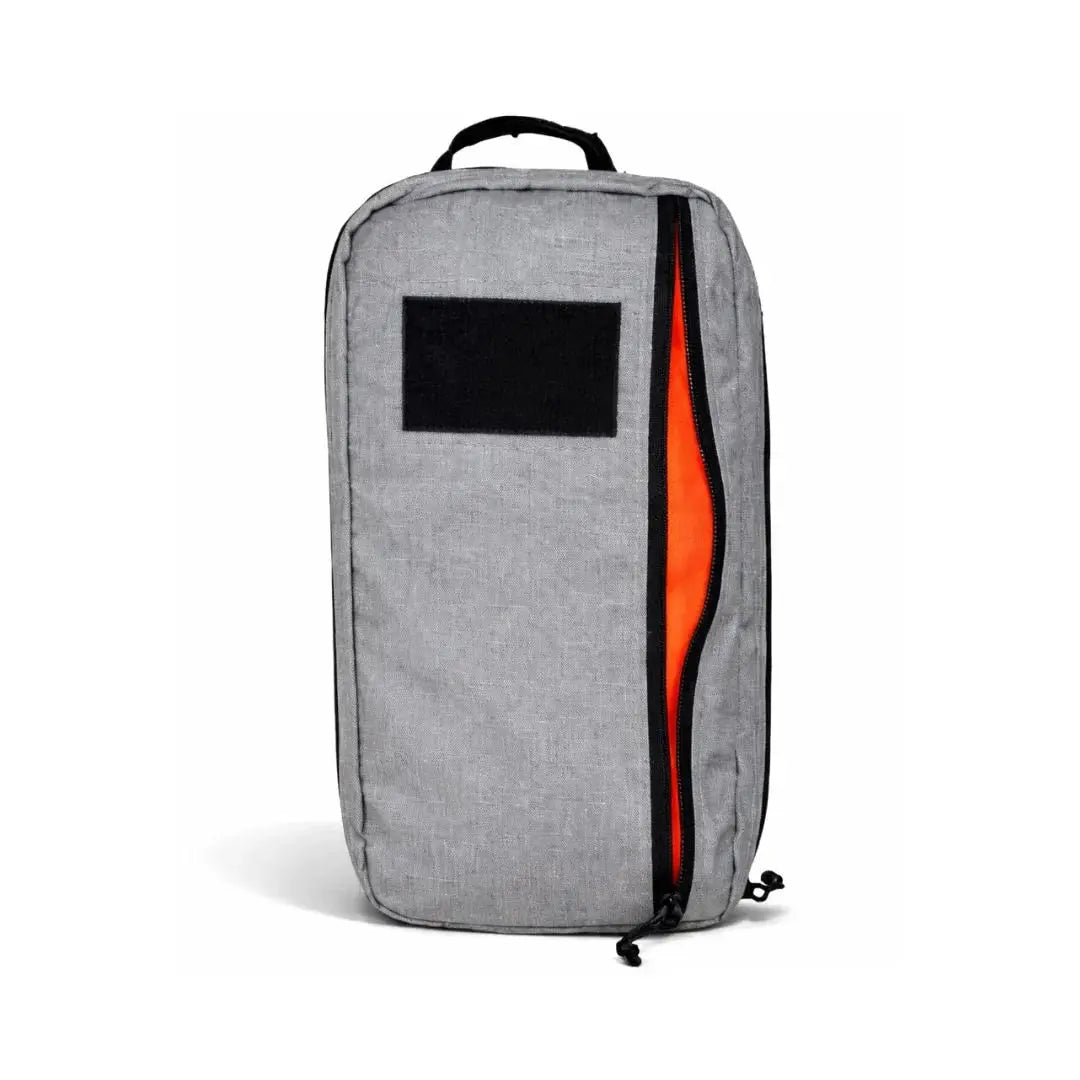Gray 24 Hour Backpack with orange interior and black patch