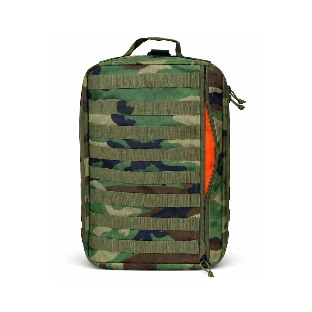 Camouflage tactical backpack with an open zipper revealing a bright orange interior.