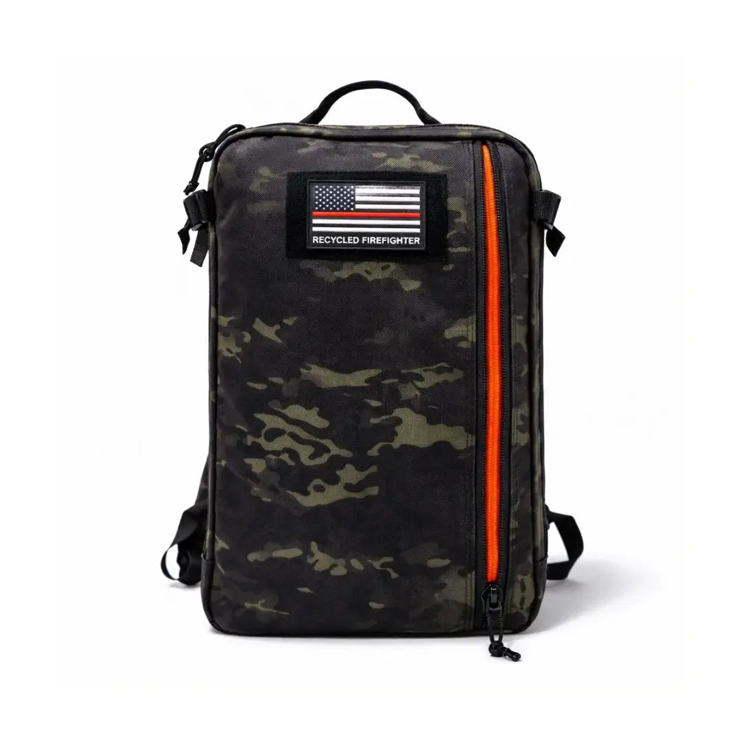 Camouflage backpack with US flag firefighter patch and bright orange zipper.
