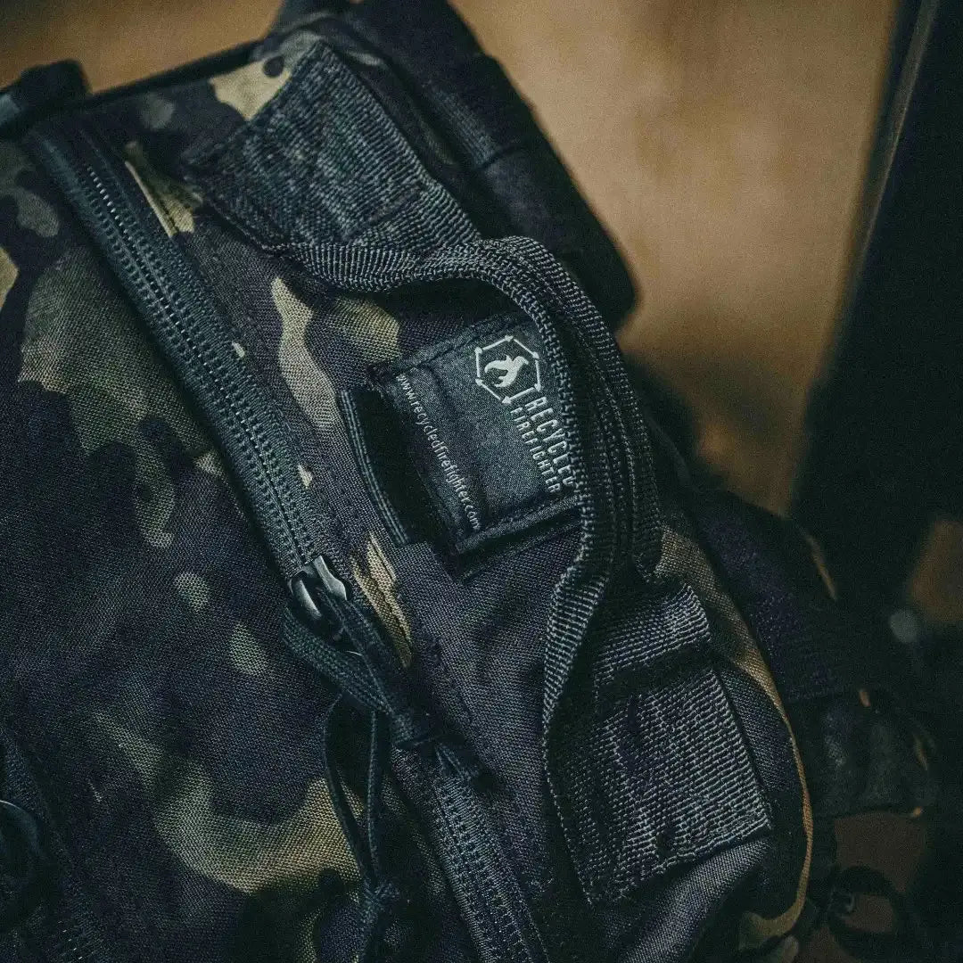 Recycled Firefighter backpack with multicam pattern and zipper detail.