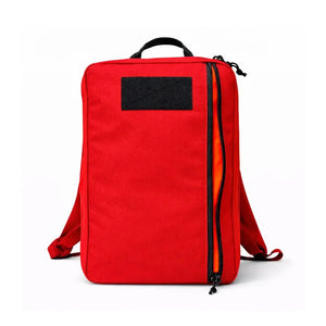 Red backpack with black patch and orange-lined zipper.