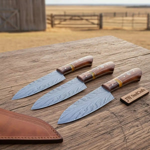 Handmade damascus steel knife with wood handle on dark surface