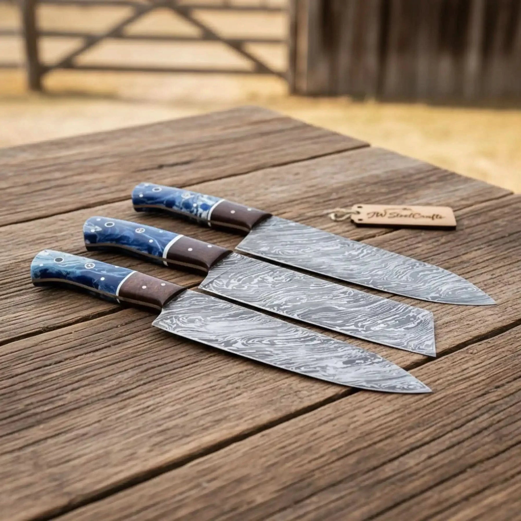 Handmade damascus steel knife with wood handle on dark surface