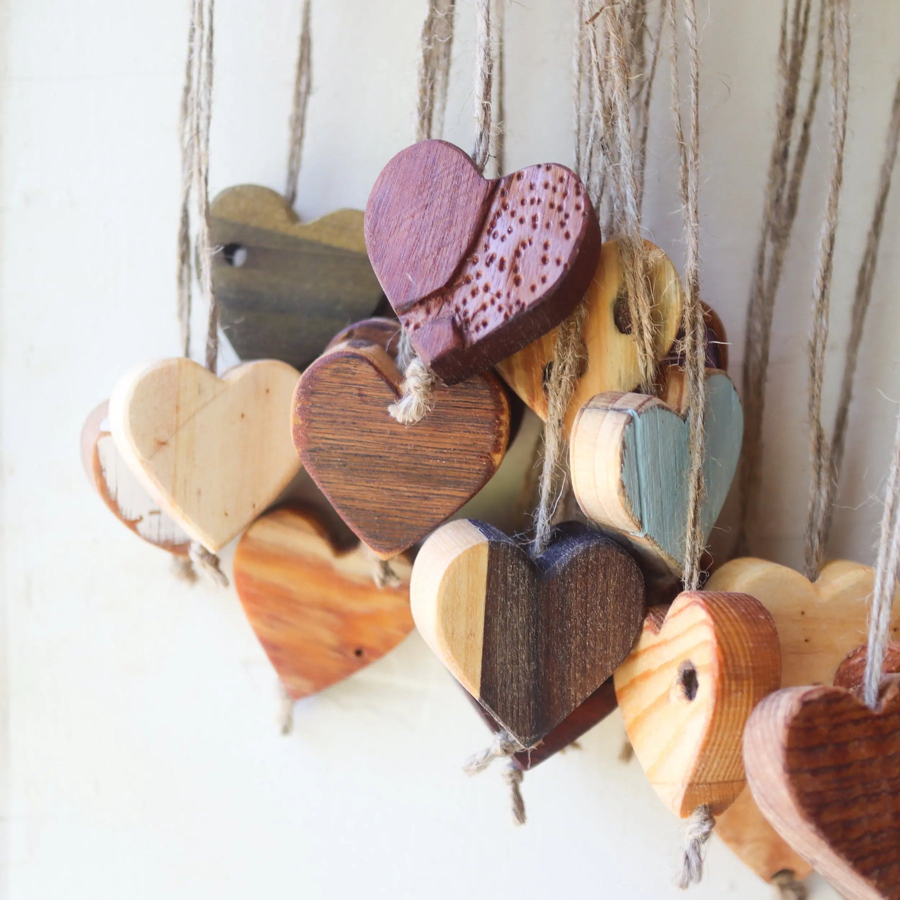 Hanging wooden heart ornaments made of natural jute twine