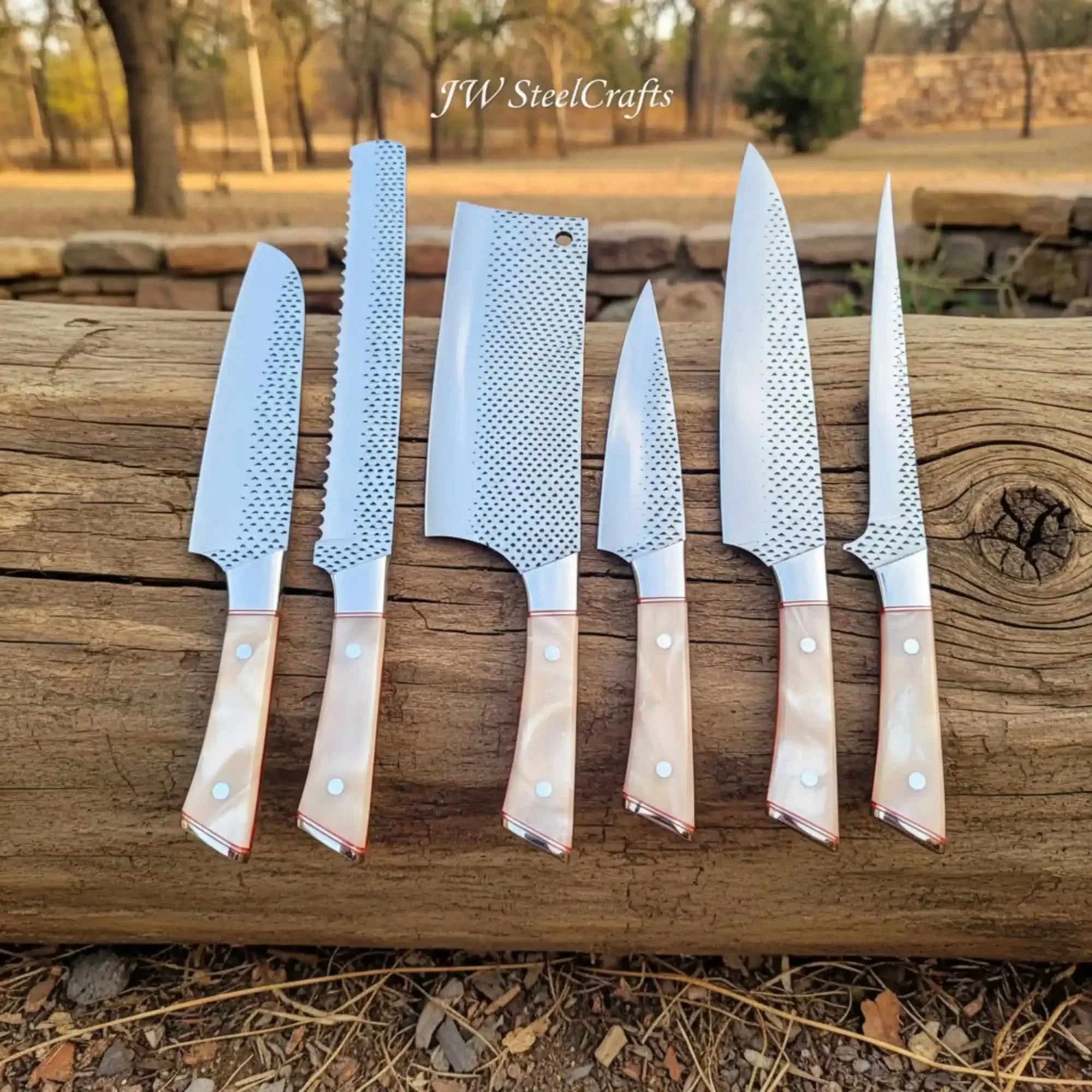 Handmade damascus steel knife with resin handle on dark surface