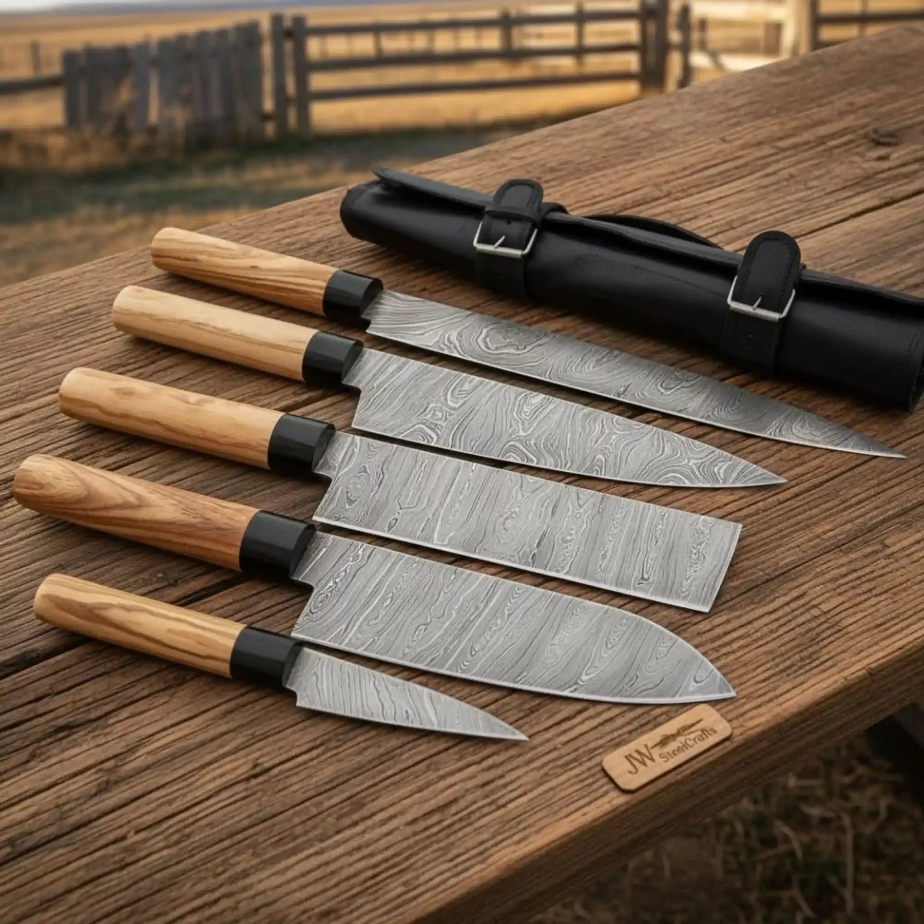 Handmade damascus steel knife with wood handle on dark surface