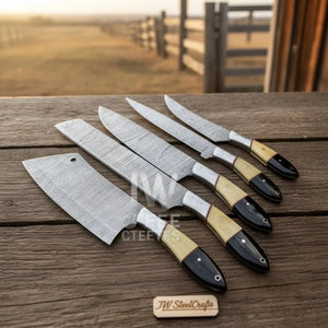 Handmade damascus steel knife with wood handle on dark surface