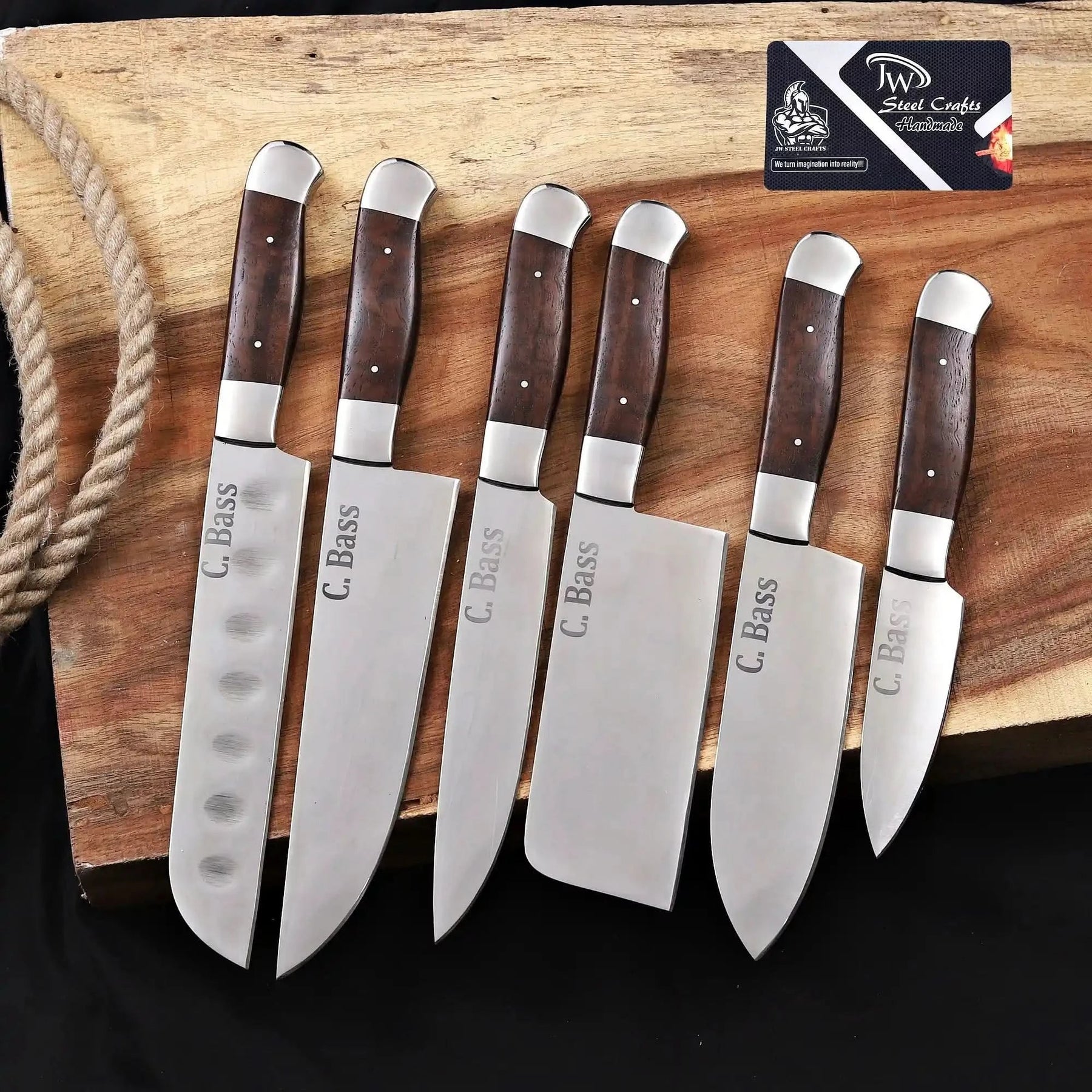 Handmade carbon steel steel knife with wood handle on dark surface