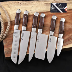 Handmade carbon steel steel knife with wood handle on dark surface