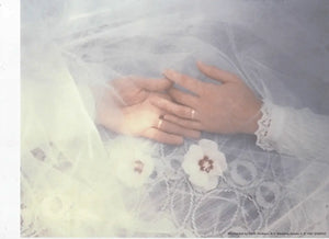 Wedding Scene: Hands with Rings Symbolizing Love and Commitment