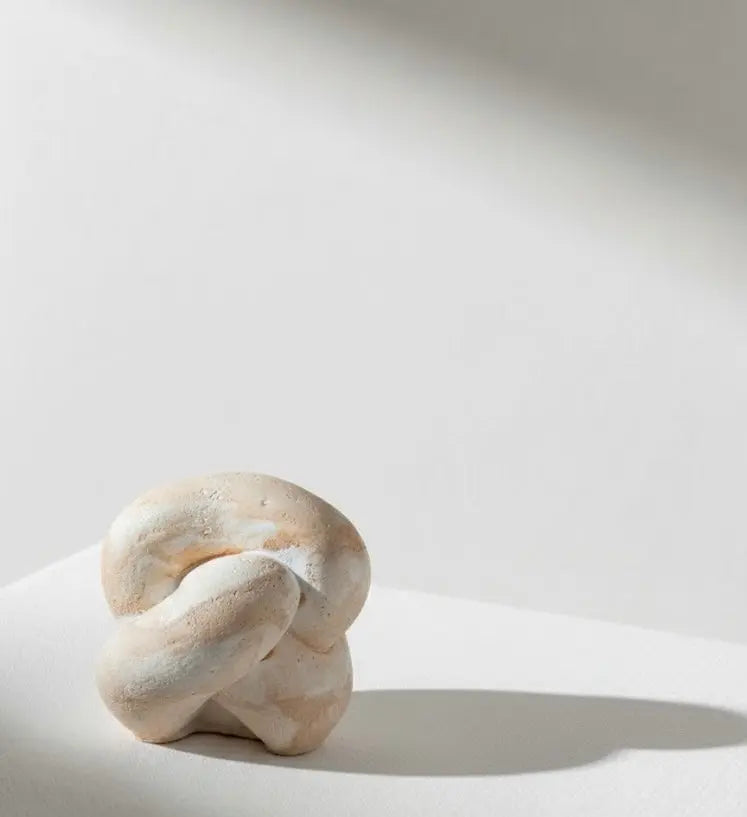 Abstract knot stone decor by Believe Candle