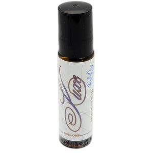 Amber Luxe roll-on oil in a glass bottle with a black cap.