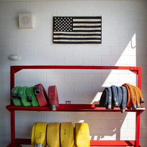 American flag made of rolled fire hoses with Second Amendment text.