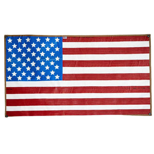 American flag made from waterproof recycled rubber fire hose with brass grommets.