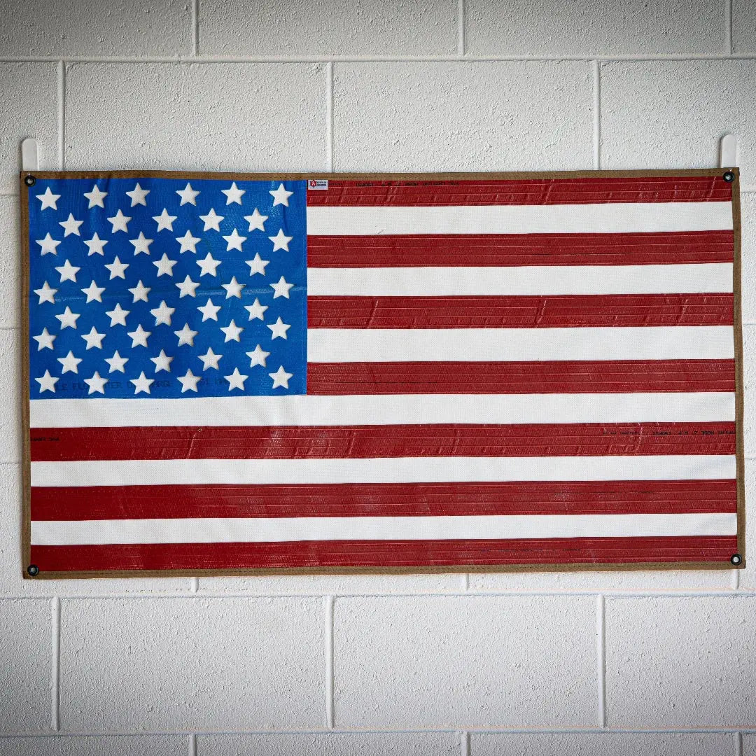 American flag made from recycled waterproof fire hose with brass grommets.