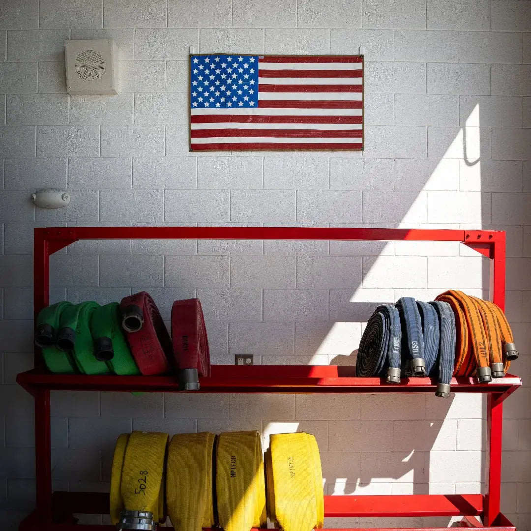 American flag made from red, white, and blue rubber fire hose.