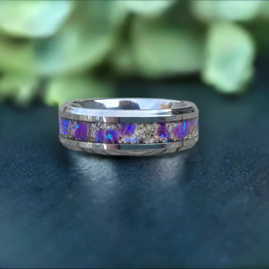 Amethyst Opal and cremation ashes ring, close-up view of a silver band with a purple and gray stone inlay.