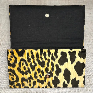 Open ASHLEY CLUTCH with leopard print exterior and black linen interior