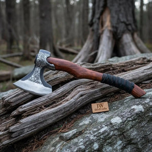 Carbon steel steel axe head with wood handle on rustic wood surface