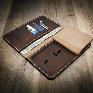 Open brown leather long badge wallet with card slots and cash compartment.