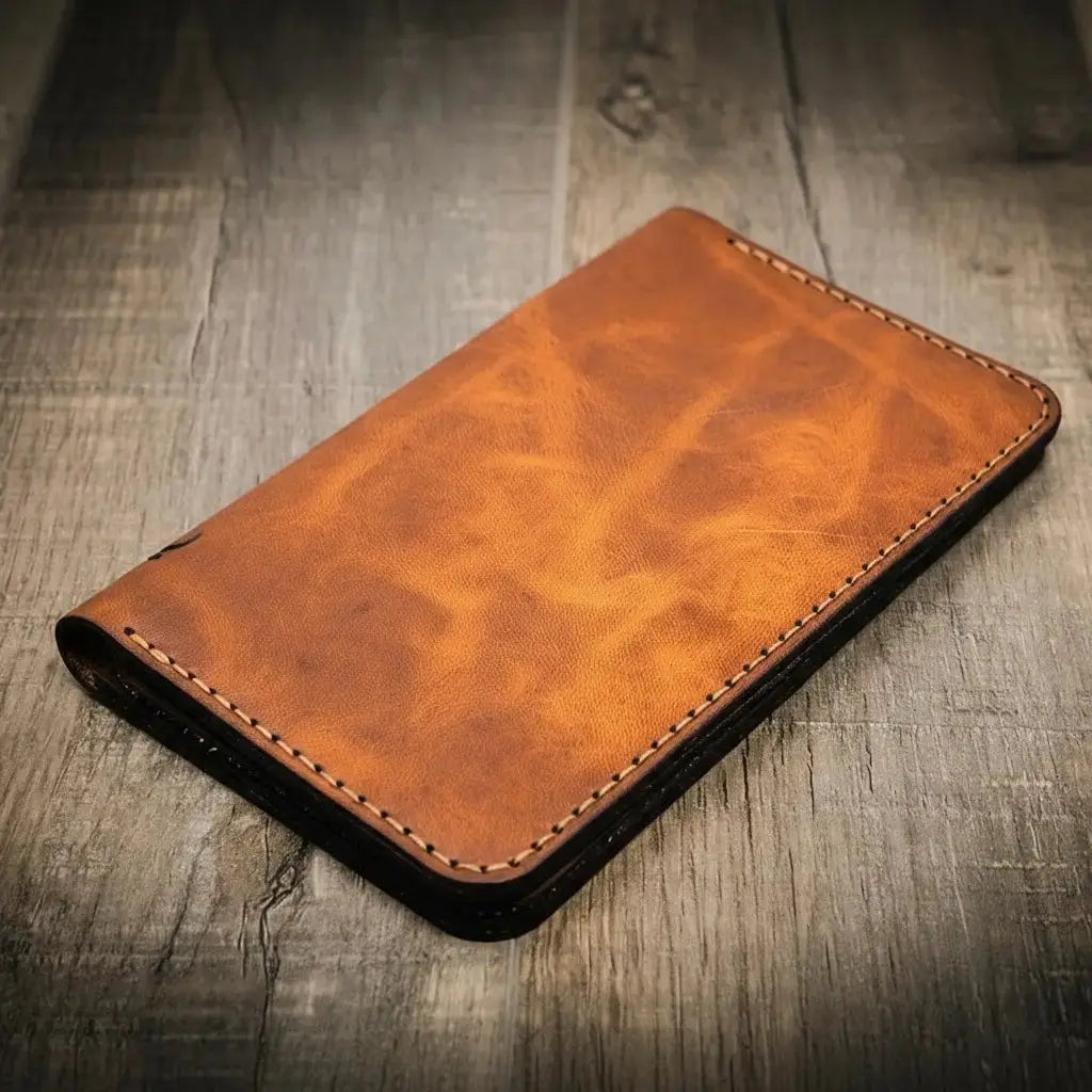 Brown leather long wallet with contrasting stitching.