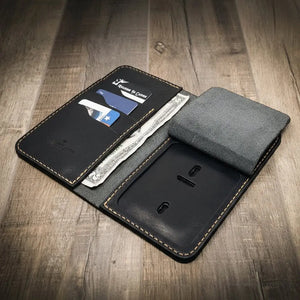 Black leather long badge wallet with card slots and a clear ID window.