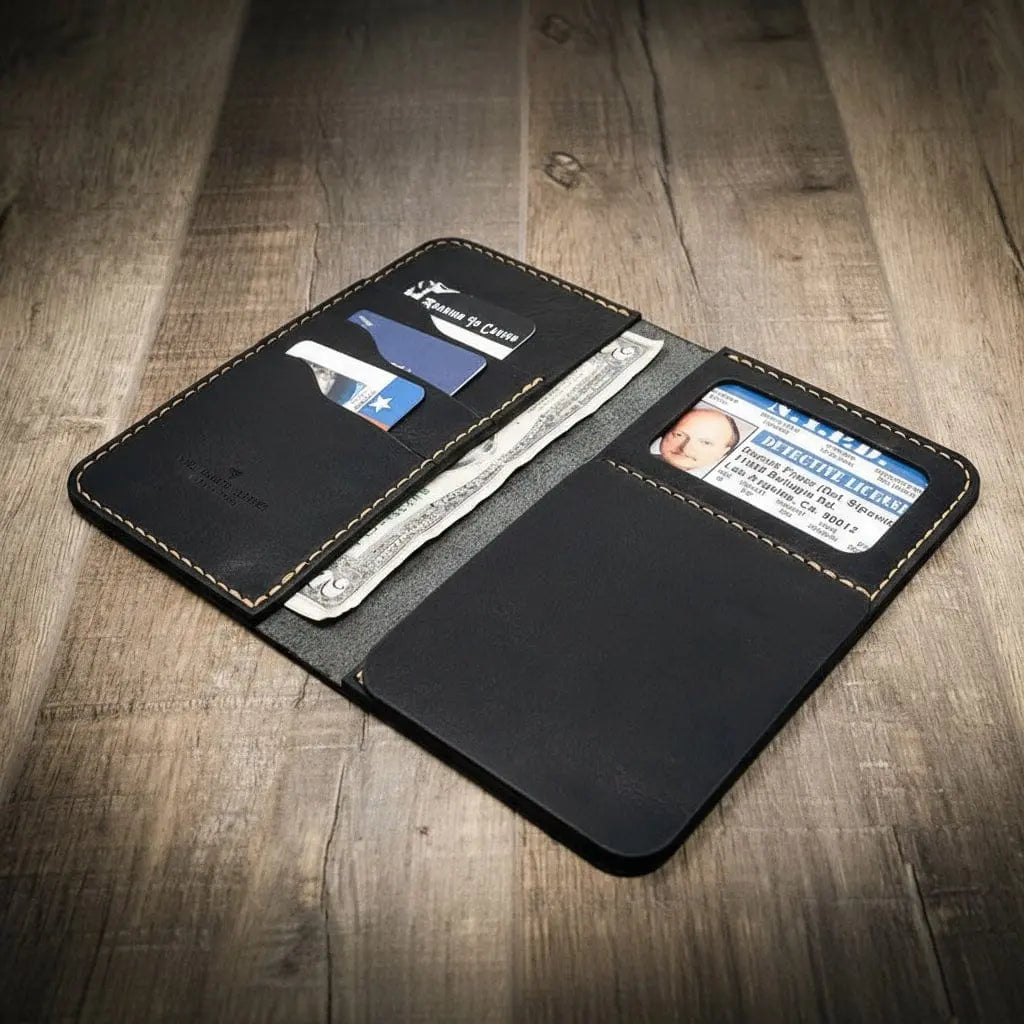 Black leather long wallet open with detective license and cash inside.