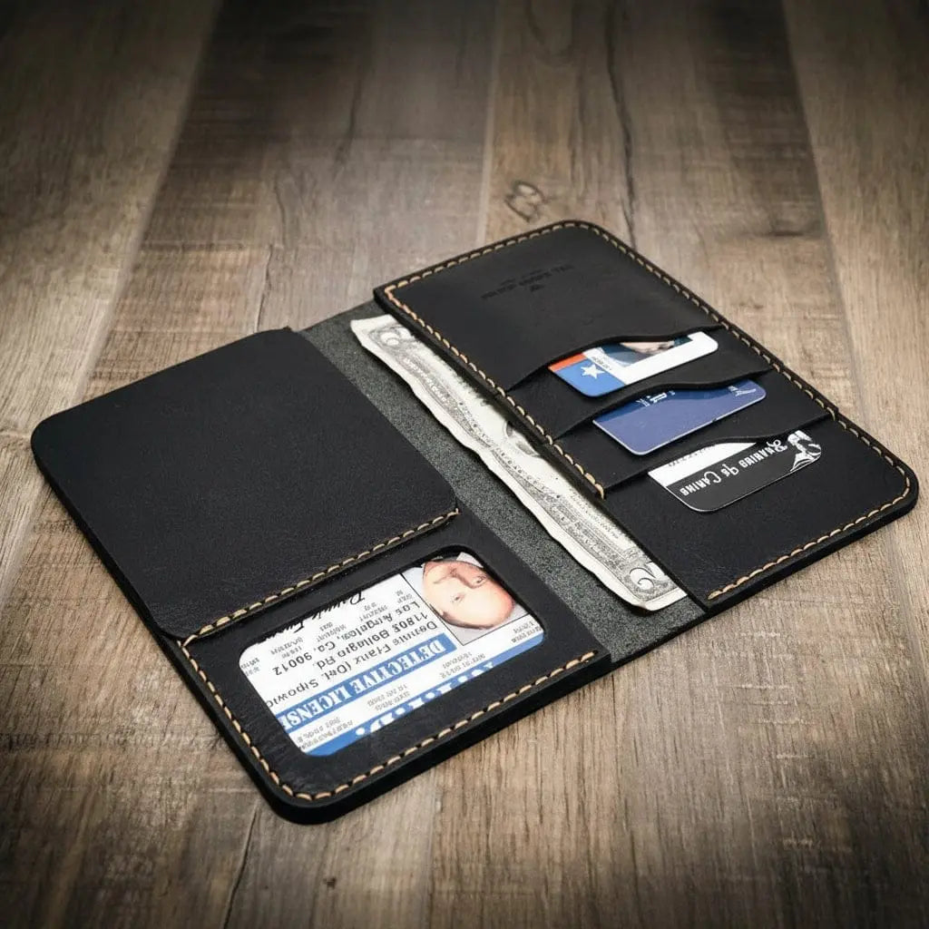 Black leather long wallet open showing ID, cards, and bills