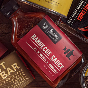 Glass bottle of Bourbon Barrel Aged Barbecue Sauce with Sorghum.