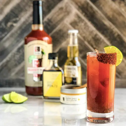Bloody Mary cocktail with limes and Bourbon Barrel Foods mixer