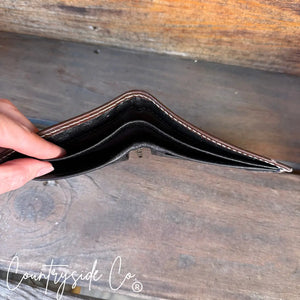 Men's brown leather bi-fold wallet interior with card slots.