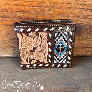 Brown leather men's wallet with beaded cross detail and floral tooling.