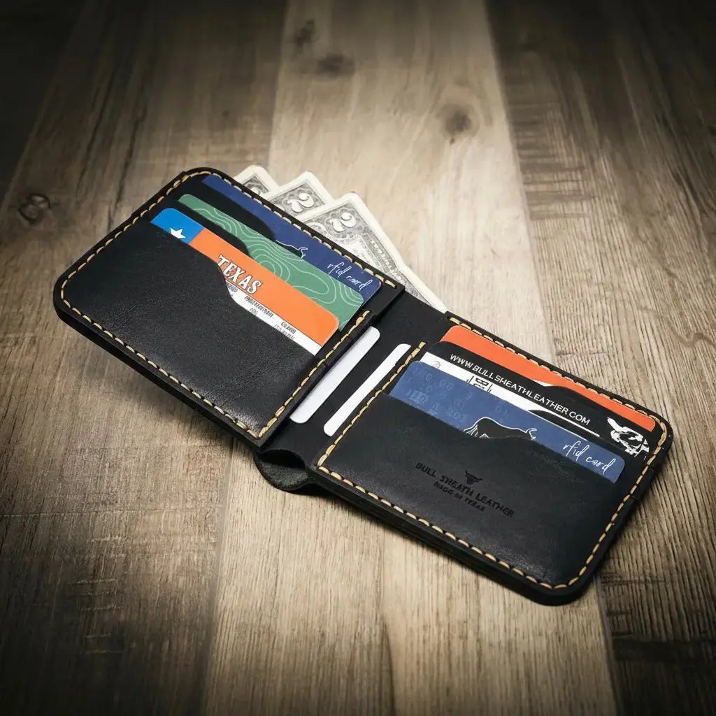 Black leather bifold wallet with Texas license and credit cards.