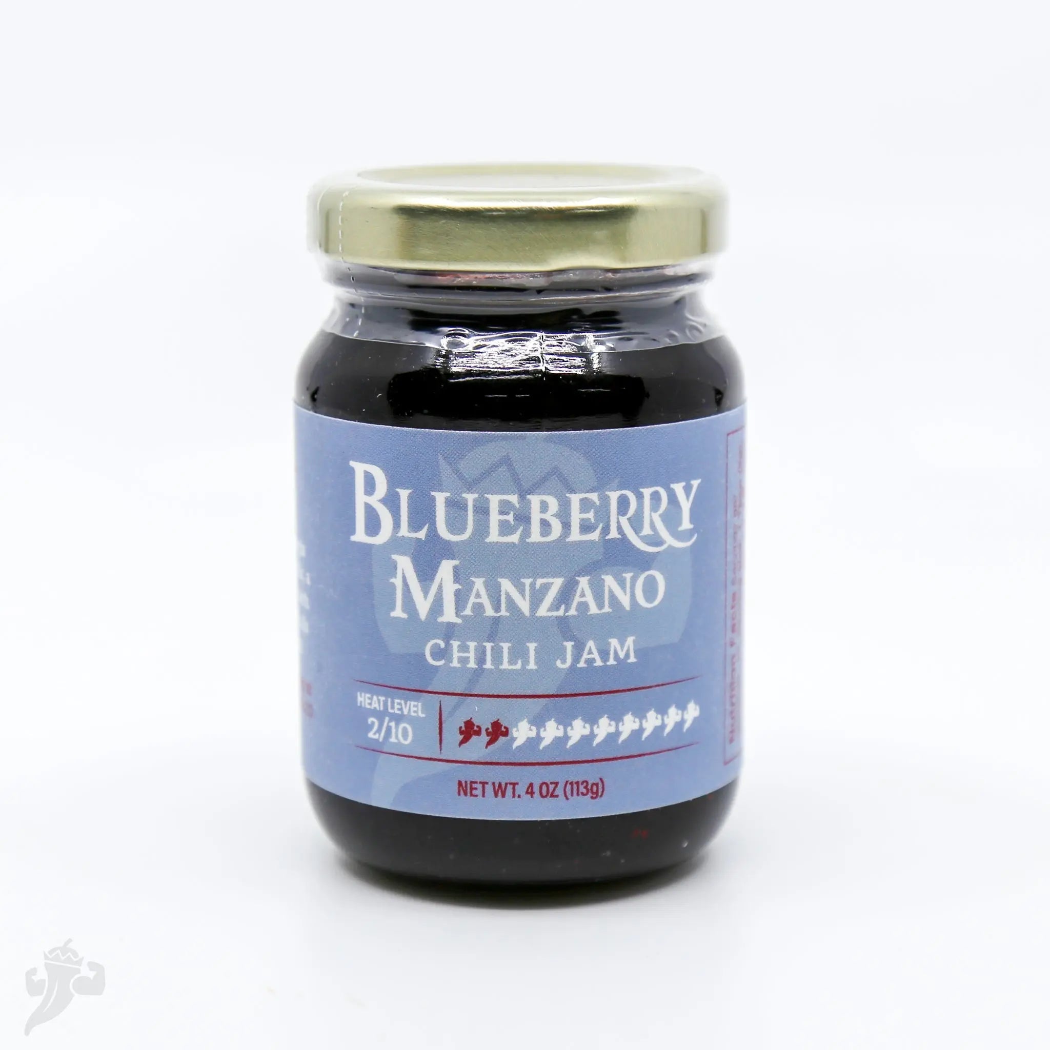 Blueberry Manzano Chili Jam in glass jar with gold lid