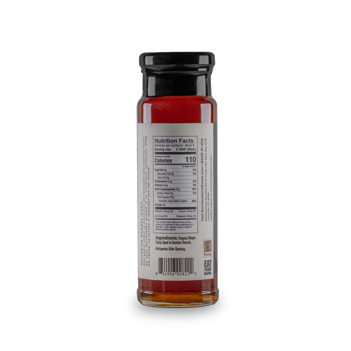 Bottle of bourbon barrel aged maple syrup with nutrition label and ingredient information.
