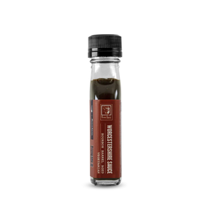 Bourbon barrel aged Worcestershire sauce in a glass bottle with a black cap