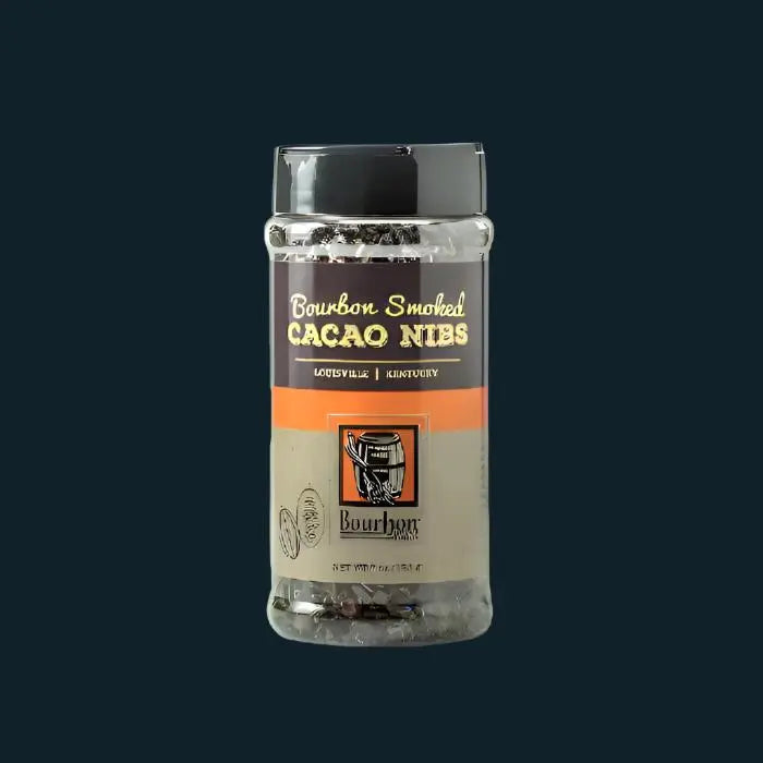 Bourbon smoked cacao nibs in a clear plastic container with a black lid.