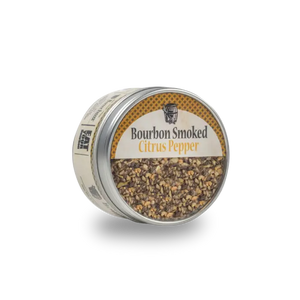 Bourbon Smoked Citrus Pepper spice blend in a round tin