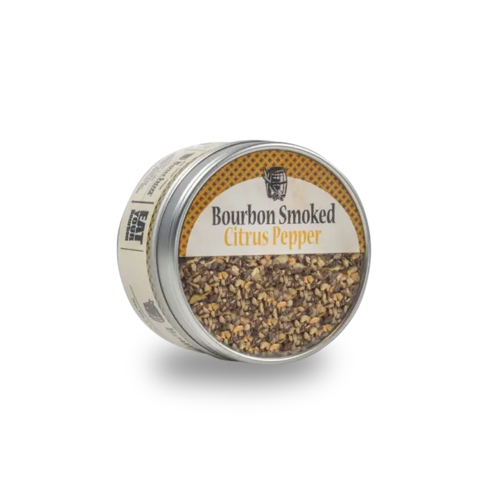Bourbon Smoked Citrus Pepper spice blend in a round tin