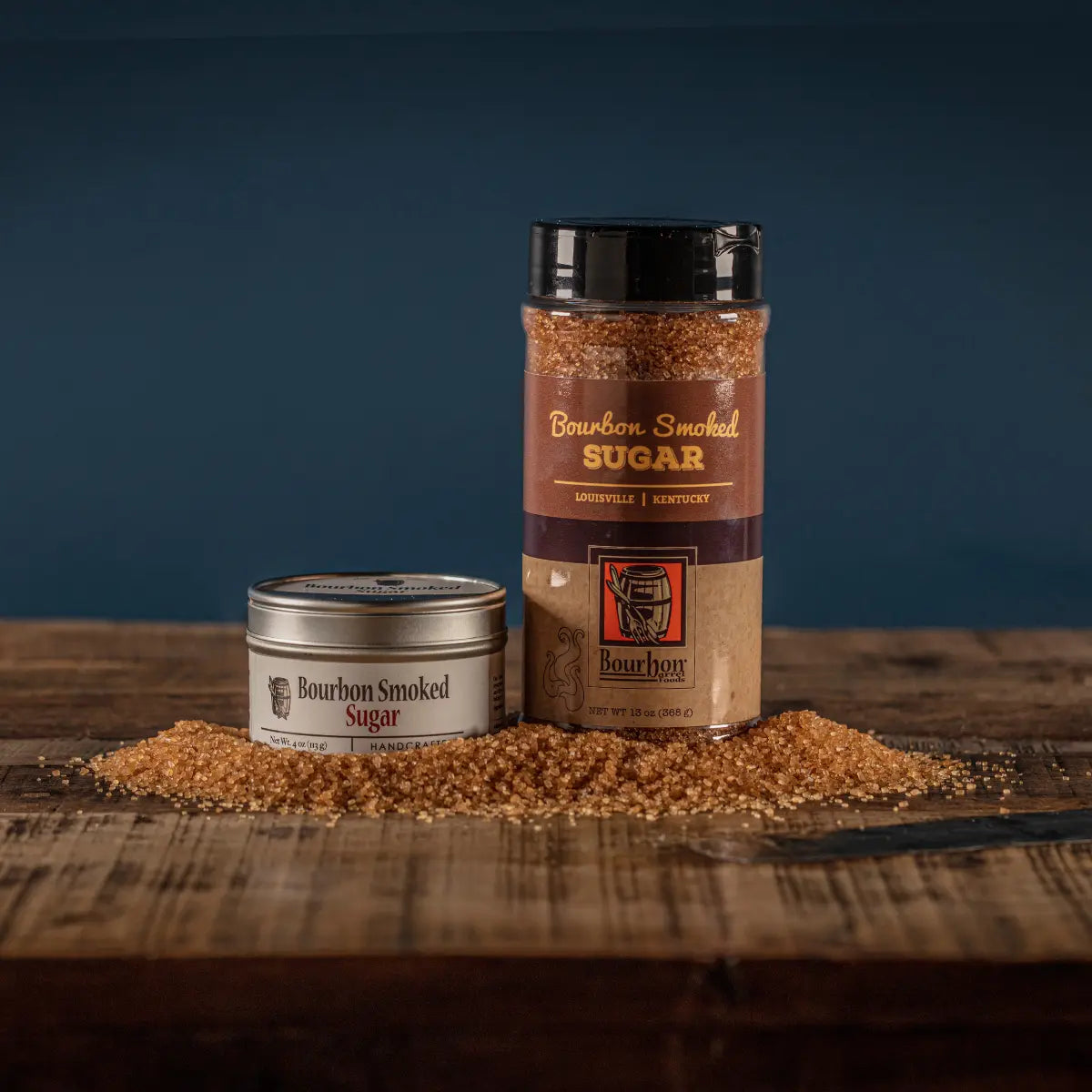 Bourbon Smoked Sugar in a tin with smoky Demerara sugar for baking and drinks