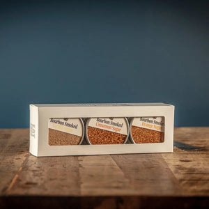Bourbon Smoked Sugars Trio in glass jars: Orange, Vanilla, and Cinnamon.