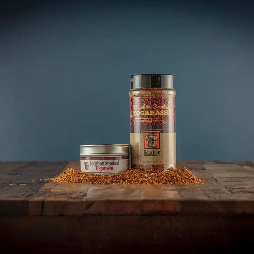 Bourbon Smoked Togarashi seasoning in tin and shaker on wood