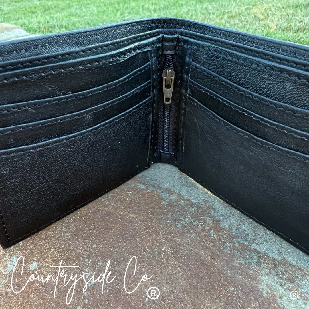 Black leather bi-fold wallet with multiple card slots and a zippered compartment.