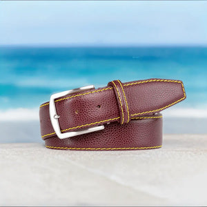 Close up of burgundy French pebble grain leather texture