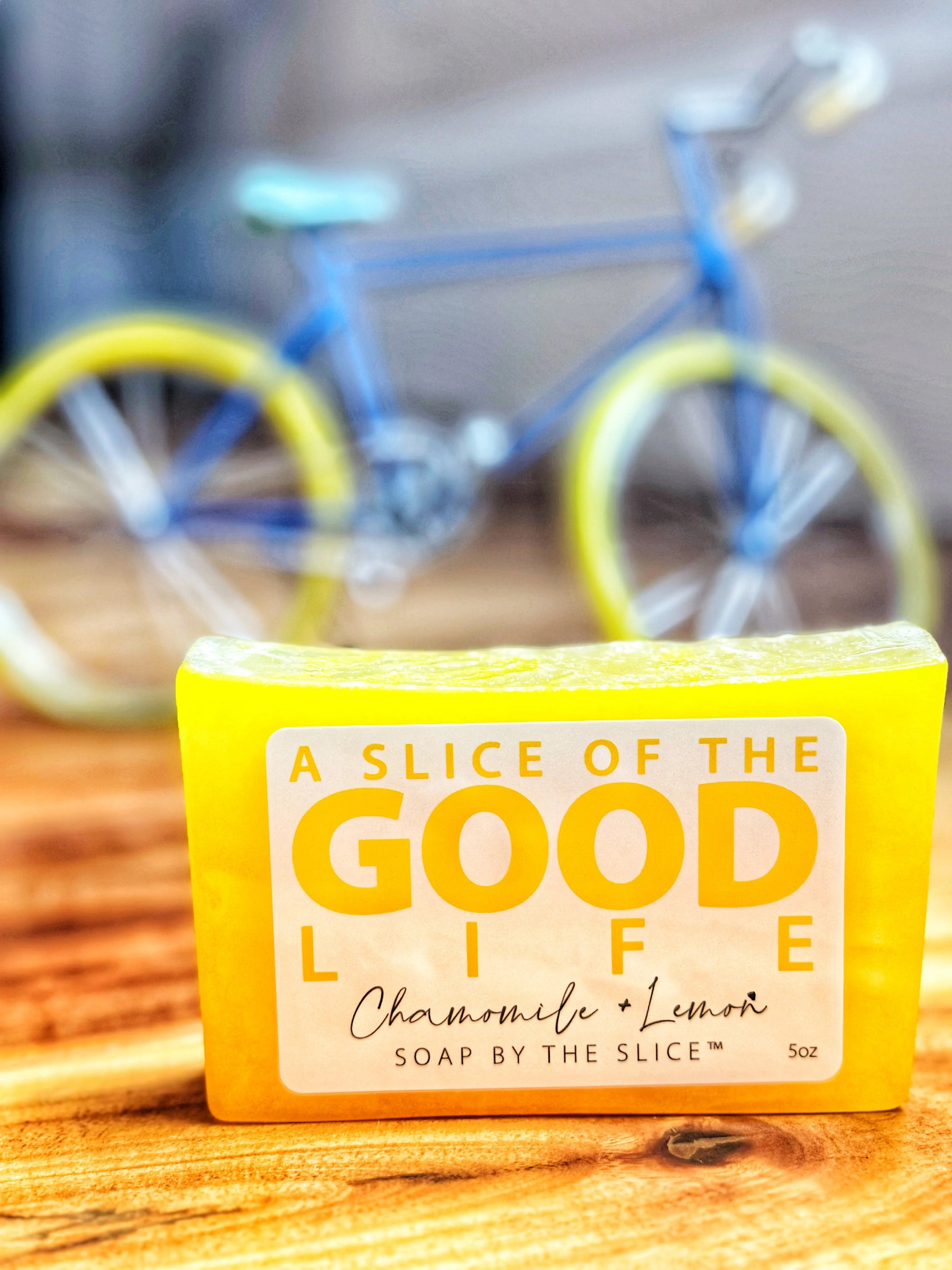 Yellow bar soap labeled "A Slice of the Good Life Chamomile + Lemon 5oz"