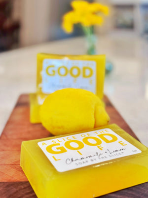 Yellow soap bar with a lemon slice and "GOOD LIFE" label, chamomile and lemon scented.