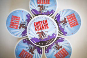 Multiple containers of Crotch Grease natural anti-chafing balm arranged in a circular pattern.