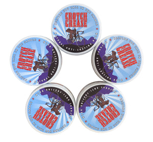 Five round tubs of Crotch Grease anti-chafing balm with cycling imagery and text.